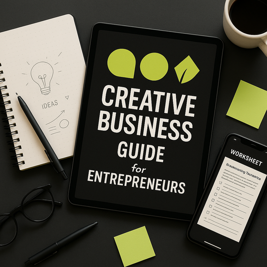 Tablet displaying 'Creative Business Guide for Entrepreneurs' on a desk with a notebook, phone, and coffee cup.