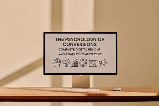 Computer monitor displaying 'The Psychology of Conversions' digital bundle on a desk.
